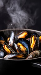 Steaming Hot Mussels in Black Cast Iron Pan on Dark Background