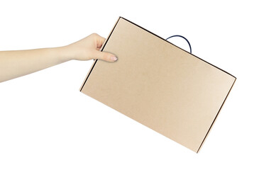 cardboard suitcase, brown cardboard box for laptop computer in hand, outstretched hand with cardboard suitcase isolated from background