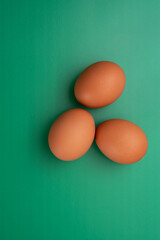 Egg crisis. Chicken eggs lie on a colored background