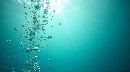 Underwater Bubbles Ascending to Surface with Bright Sunlight Rays in Clear Turquoise Ocean Water - Natural Underwater Scene