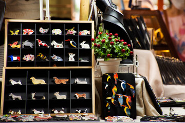 Thai craftsmanship technician or professional ceramicist made handmade ceramic accessories and handicraft ornament earthenware for show and sale in studio workshop at craft market in Bangkok Thailand