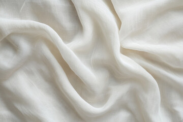 Obraz premium Soft white fabric drapes elegantly in natural light, showcasing delicate textures and gentle folds
