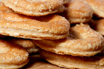 Delicious baked treats stacked invitingly on a wooden surface