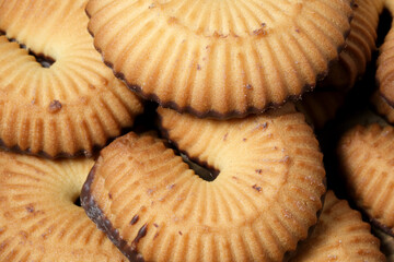 Delicious chocolate-dipped cookies piled high for afternoon delight