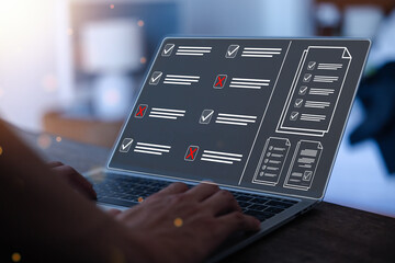 Obraz premium Businessman working on computer using laptop. Concept of business performance tracking and evaluation. Document management system DMS. Performance checklist evaluation form.