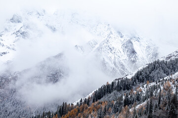 snow and fog covered mountains in winter in western Sichuan of China
