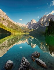  Serene mountain range reflected in crystal clear lake, showcasing nature beauty 