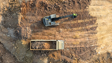 Excavator digs move earth at construction site, Excavator working and digging at construction site,...