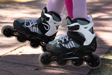 roller skates on the ground, sun light and shadows