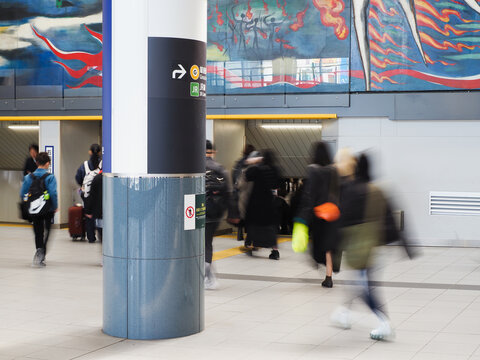 TOKYO, JAPAN - March 18, 2025: Concourse in Shibuya train station with a mural by Taro Okamoto, The Myth of Tomorrow mural Taro Okamoto.