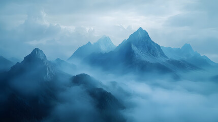 Obraz premium Majestic mountain peaks in morning mist wallpaper background serene nature scene atmospheric landscape photography