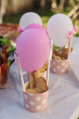 Delightful party decorations featuring sweet treats and colorful balloons