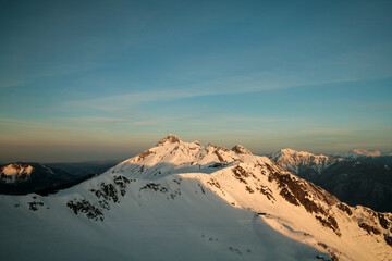 Snow-capped Caucasus Mountains at dawn, Sochi, Russia.