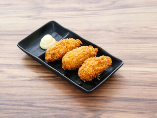 Kaki Fry or Fried Oysters with Mayonnaise served in tray dish isolated on table side view of Japanese food