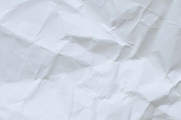 Crumpled white paper background. Crumpled white paper texture or paper background. Light background with copy space. Top view