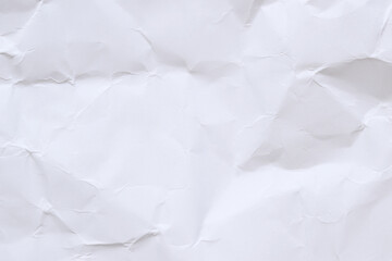 Crumpled white paper background. Crumpled white paper texture or paper background. Light background with copy space. Top view