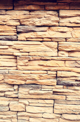 Texture stone background of stone bricks made of sand, stone background of stone wall made of sand stone blocks