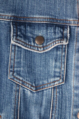 Denim Pocket: A close-up shot of a denim pocket on a jacket reveals the intricate textures and details of the fabric, showcasing the timeless appeal of classic denim.