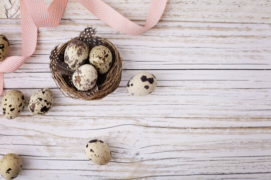easter eggs on rustic white wooden background