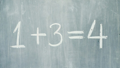 Simple math equation on a chalkboard