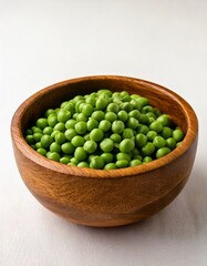 Close up photo of Great British Pea in a wooden bowl with a plain white background