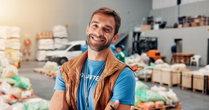 Confident, man and portrait of volunteer at food drive for charity, donation or non profit event. Happy, activism and face of male NGO worker at community center for help in society at workshop.