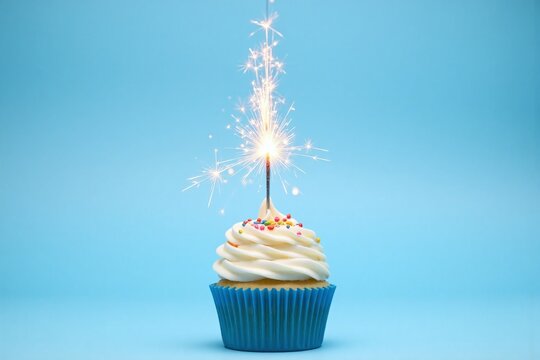 cupcake with a sparkler on top of it