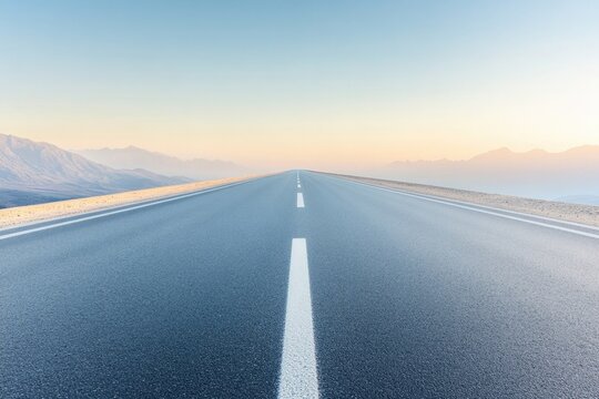 empty road under clear sky stretching into horizon with soft sunlight illuminating path symbolizing new journeys and