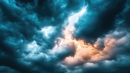 Obraz premium Dramatic storm clouds illuminated by orange light, creating a vibrant sky scene with dynamic weather patterns