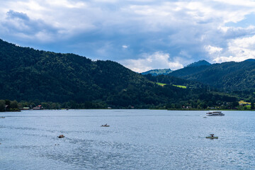 Idyllic panorama view of Tegernsee lake with Bavarian alps in background on a sunny summer day, Tegernsee, Bavaria, Germany