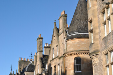 Close Up of Turret and Facade of Old Scottish 19th Century Public Building seen against Blue Sky