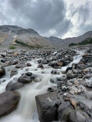 Inter Fork of the White River flowing next to Glacier Basin Camp in Mount Rainier National Park, long or extended exposure of river flowing