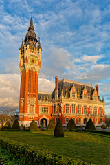 Obraz premium City Hall (french : Hotel de Ville) is the seat of the city council in Calais. The building featuring a belfry of red brick was designated historic monument and commemorates its centenary in 2025.