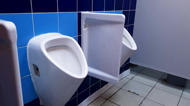 Public restroom, urinal. Public men's toilet.