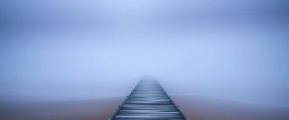 Obraz premium Mysterious foggy pathway coastal area landscape photography minimalistic setting wide angle serenity in nature