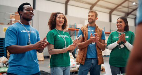 Volunteer teamwork, people and celebration with applause in warehouse for outreach success and...