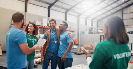 Volunteer group, people and celebration with applause in warehouse for outreach success, charity or...