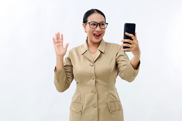 Surprised young civil servant woman holding cell phone with wow expression