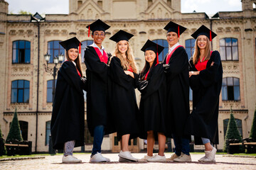 Full size photo of company groupmates folded hands posing mortarboard gown graduate college...