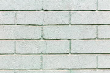 Light green brick wall texture with minimalist clean pattern background. Light green brick texture surface for interior design usage. Concept modern minimalist brick wall design for stylish home decor