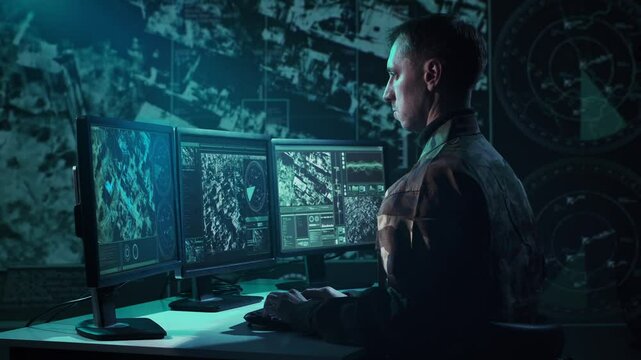 Military soldier operating advanced technology in a command center.