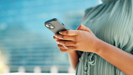City, phone and hands of business woman for networking, social media and website for contact. Professional, corporate and person on smartphone for text message, email and online in town for travel. © FremeFlex/peopleimages.com