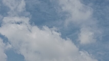Bright sky with soft white nimbus clouds, creating a serene background in good weather.