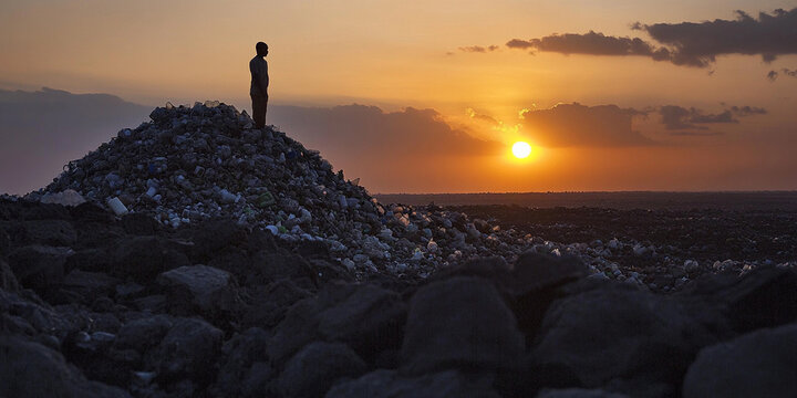 Plastic mountain rises against a vibrant sunset backdrop Generative AI