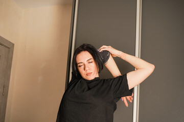 Close-up of a girl with short black hair. Daily life of a girl. Daily routine for sports and...
