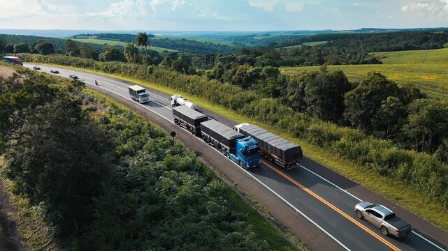 Aerial view of the highway BR277 with cars and trucks moving on it. State of Parana, Brazil