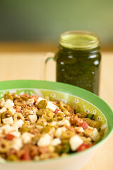 Mediterranean pasta salad with green smoothie