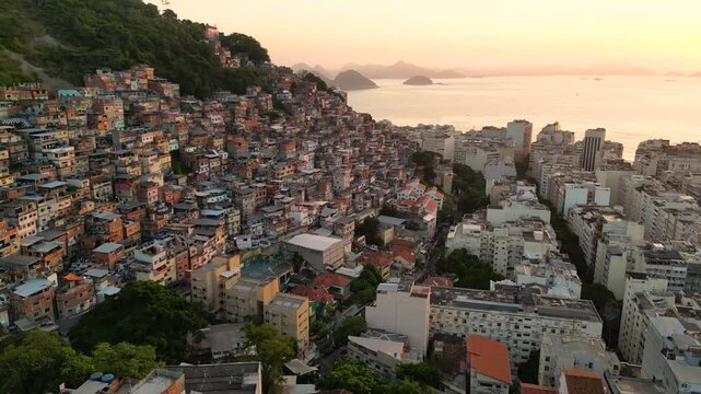 Aerial View of Cantagalo Slum and Copacabana District Below on Sunrise in Rio de Janeiro, Brazil