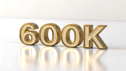 A shiny golden six hundred k on a white surface with reflection in a studio setting for celebration