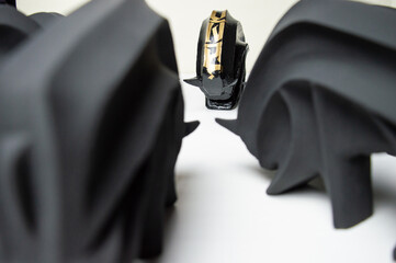 homemade bison figurines made of plaster at home. Black bison figurines to decorate the interior of...
